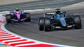 Mercedes' British driver George Russell drives ahead of Alpine's Argentine driver Franco Colapinto on the third day of the Formula One pre-season testing at the Bahrain International Circuit in Sakhir on February 13, 2026. (Photo by Giuseppe CACACE / AFP)