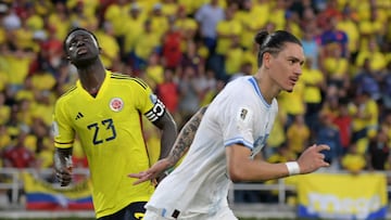 Uruguay's forward Darwin Nunez (R) celebrates next to Colombia's defender Davinson Sanchez after scoring his team's second goal from the penalty spot during the 2026 FIFA World Cup South American qualification football match between Colombia and Uruguay at the Roberto Melendez Metropolitan Stadium in Barranquilla, Colombia, on October 12, 2023. (Photo by Raul ARBOLEDA / AFP)