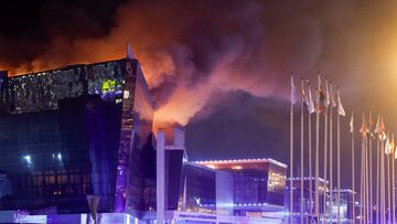 Smoke rises above the burning Crocus City Hall concert venue following a reported shooting incident, outside Moscow, Russia, March 22, 2024. REUTERS/Maxim Shemetov