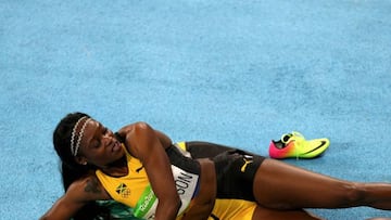 RIO DE JANEIRO, BRAZIL - AUGUST 17: Elaine Thompson of Jamaica reacts after winning the gold medal in the Women&#039;s 200m Final on Day 12 of the Rio 2016 Olympic Games at the Olympic Stadium on August 17, 2016 in Rio de Janeiro, Brazil. (Photo by Ian Wa