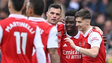 Arsenal's English midfielder Bukayo Saka (2R) celebrates with teammates after scoring their fourth goal during the English Premier League football match between Arsenal and Crystal Palace at the Emirates Stadium in London on March 19, 2023. (Photo by JUSTIN TALLIS / AFP) / RESTRICTED TO EDITORIAL USE. No use with unauthorized audio, video, data, fixture lists, club/league logos or 'live' services. Online in-match use limited to 120 images. An additional 40 images may be used in extra time. No video emulation. Social media in-match use limited to 120 images. An additional 40 images may be used in extra time. No use in betting publications, games or single club/league/player publications. / 