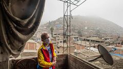 Venezuelan Wilmer (L), 15, poses for a photograph at the house of the Hernandez family in Villa Maria del Triunfo on the southern outskirts of Lima on June 25, 2020. - The 14 members of the Hernandez family arrived in Peru from Venezuela two years ago, but the coronavirus has put their hopes for a better life in check: The grandfather died and the other 13 are trying to survive the disease. (Photo by ERNESTO BENAVIDES / AFP)