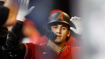 MILWAUKEE, WISCONSIN - OCTOBER 04: Alek Thomas #5 of the Arizona Diamondbacks high fives teammates after hitting a solo home run during the fifth inning against the Milwaukee Brewers in Game Two of the Wild Card Series at American Family Field on October 04, 2023 in Milwaukee, Wisconsin.   John Fisher/Getty Images/AFP (Photo by John Fisher / GETTY IMAGES NORTH AMERICA / Getty Images via AFP)