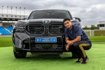 Jude poses with his new BMW.