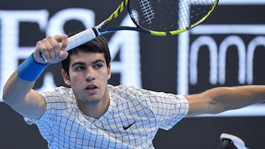 Spain's Carlos Alcaraz returns a shot to Argentina's Sebastian Baez during their semi-final match of the Next Generation ATP Finals tournament on November 12, 2021 at the Allianz Cloud venue in Milan. (Photo by Tiziana FABI / AFP)