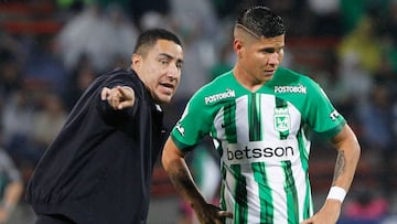 Atletico Nacional's Mexican coach Efrain Juarez gives instruction to midfielder Jorman Campuzano during the Colombian football league quadrangular semifinal match between Nacional and Santa Fe at Atanasio Girardo stadium in Medellin, Colombia, on November 20, 2024. Colombian police on November 20 sanctioned Atletico Nacional's Mexican coach Efrain Juarez with a three-year ban from the country's stadiums and a fine for "provoking fans" at the end of a match on November 17. (Photo by AFP)