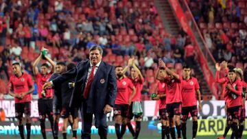 Tijuana's coach Miguel Herrera (C) and players celebrate at the end the Mexican Apertura tournament football match between Tijuana and Cruz Azul at Caliente stadium in Tijuana, Baja California, Mexico, on July 14, 2023. (Photo by Guillermo Arias / AFP)