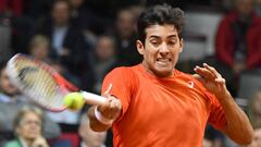 Chile`s Christian Garin returns the ball to Dennis Novak of Austria during the Davis Cup tennis qualifiers match between Austria and Chile on February 1, 2019 in Salzburg. (Photo by BARBARA GINDL / APA / AFP) / Austria OUT