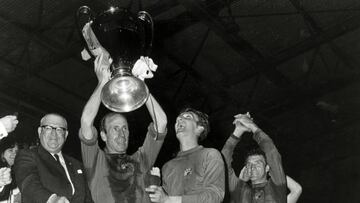 Charlton holds the trophy aloft after Manchester United's European Cup win in 1968.