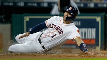 HOUSTON, TX - JULY 15: Carlos Correa #1 of the Houston Astros slides past Jason Castro #21 of the Minnesota Twins to score in the second inning on a double by Yuli Gurriel #10 in the second inning against the Minnesota Twins at Minute Maid Park on July 15, 2017 in Houston, Texas.   Bob Levey/Getty Images/AFP
 == FOR NEWSPAPERS, INTERNET, TELCOS &amp; TELEVISION USE ONLY ==