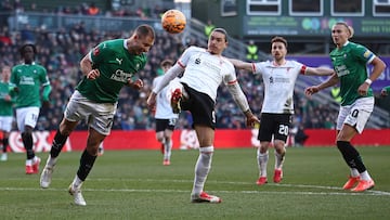 Plymouth's Bosnian defender #25 Nikola Katic (L) headers the ball away from Liverpool's Uruguayan striker #09 Darwin Nunez during the English FA Cup fourth round football match between Plymouth Argyle and Liverpool at Home Park in Plymouth, south west England, on February 9, 2025. (Photo by HENRY NICHOLLS / AFP) / RESTRICTED TO EDITORIAL USE. No use with unauthorized audio, video, data, fixture lists, club/league logos or 'live' services. Online in-match use limited to 120 images. An additional 40 images may be used in extra time. No video emulation. Social media in-match use limited to 120 images. An additional 40 images may be used in extra time. No use in betting publications, games or single club/league/player publications. /