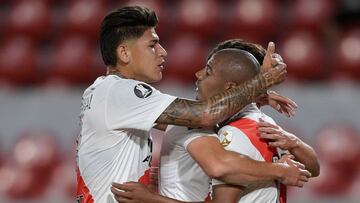 Argentina&#039;s River Plate Uruguayan Nicolas De La Cruz celebrates with teammates Colombian Jorge Carrascal (L) and Julian Alvarez after scoring against Brazil&#039;s Athletico Paranaense during the closed-door Copa Libertadores round before the quarterfinals football match, at the Libertadores de America stadium in Avellaneda, Buenos Aires, on December 1, 2020. (Photo by Juan Mabromata / various sources / AFP)