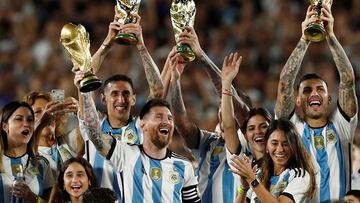 FILE PHOTO: Soccer Football - International Friendly - Argentina v Panama - Estadio Monumental, Buenos Aires, Argentina - March 23, 2023 Argentina's Lionel Messi and team mates celebrate with their families and World Cup trophies after the match REUTERS/Agustin Marcarian/File Photo