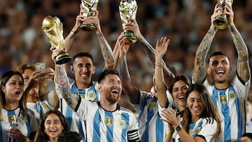 FILE PHOTO: Soccer Football - International Friendly - Argentina v Panama - Estadio Monumental, Buenos Aires, Argentina - March 23, 2023 Argentina's Lionel Messi and team mates celebrate with their families and World Cup trophies after the match REUTERS/Agustin Marcarian/File Photo