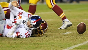 Nov 23, 2017; Landover, MD, USA; New York Giants quarterback Eli Manning (10) fumbles the ball while being sacked by Washington Redskins linebacker Junior Galette (58) in the fourth quarter at FedEx Field. The Redskins won 20-10. Mandatory Credit: Geoff Burke-USA TODAY Sports