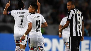 Chile&#039;s Colo-Colo player Esteban Paredes (L) celebrates with teammate Esteban Pavez (C) after scoring a goal against Brazil&#039;s Botafogo during their Copa Libertadores football match at Nilton Santos &quot;Engenhao&quot; stadium in Rio de Janeiro,