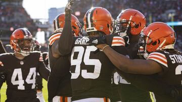 Dec 12, 2021; Cleveland, Ohio, USA; Cleveland Browns defensive end Myles Garrett (95) gets congratulated for his touchdown against the Baltimore Ravens during the second quarter at FirstEnergy Stadium. Mandatory Credit: Scott Galvin-USA TODAY Sports