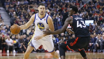 Jan 13, 2018; Toronto, Ontario, CAN; Golden State Warriors guard Klay Thompson (11) dribbles around Toronto Raptors forward Pascal Siakam (43) during the first half at the Air Canada Centre. Mandatory Credit: John E. Sokolowski-USA TODAY Sports