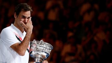 FILE PHOTO: Tennis - Australian Open - Men's singles final - Rod Laver Arena, Melbourne, Australia, January 28, 2018. Winner Roger Federer of Switzerland cries while holding the trophy. REUTERS/Thomas Peter/File Photo