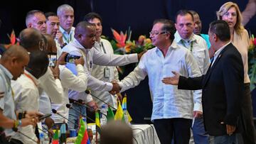 Colombian President Gustavo Petro shakes hands with mayors during the first Summit of Mayors from the Colombian Pacific Coast region, in Yumbo, Colombia on August 10, 2022. (Photo by JOAQUIN SARMIENTO / AFP) (Photo by JOAQUIN SARMIENTO/AFP via Getty Images)