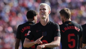 Barcelona's Spanish forward #20 Daniel Olmo celebrates scoring his team's third goal during the Spanish league football match between Girona FC and FC Barcelona at the Montilivi stadium in Girona on September 15, 2024. (Photo by LLUIS GENE / AFP)