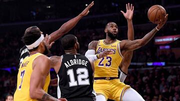 LOS ANGELES, CA - OCTOBER 22: LeBron James #23 of the Los Angeles Lakers attempts a layup past LaMarcus Aldridge #12 of the San Antonio Spurs during the first half at Staples Center on October 22, 2018 in Los Angeles, California. Harry How/Getty Images/