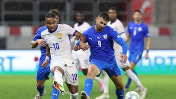 Soccer Football - UEFA Nations League - Group A2 - Israel v France - Bozsik Arena, Budapest, Hungary - October 10, 2024 France's Christopher Nkunku in action with Israel's Tai Baribo REUTERS/Bernadett Szabo
