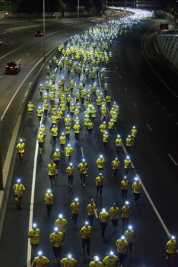 Participantes de la carrera solidaria 'Wings for Life' en Melbourne, Australia. 