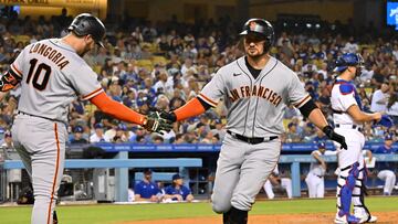 Sep 5, 2022; Los Angeles, California, USA; San Francisco Giants third baseman J.D. Davis (7) is congratulated by third baseman Evan Longoria (10) after hitting a solo home run in the second inning against the Los Angeles Dodgers at Dodger Stadium. Mandatory Credit: Jayne Kamin-Oncea-USA TODAY Sports