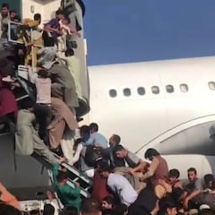 Kabul residents overrun airport in scramble to flee Taliban