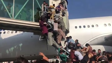 Kabul residents overrun airport in scramble to flee Taliban