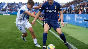 LEGANES, SPAIN - MARCH 18: Borja Sanchez of Real Oviedo is challenged by Iker Undabarrena of CD Leganes during the La Liga SmartBank match between CD Leganes and Real Oviedo at Estadio Municipal de Butarque on March 18, 2023 in Leganes, Spain. (Photo by Angel Martinez/Getty Images)