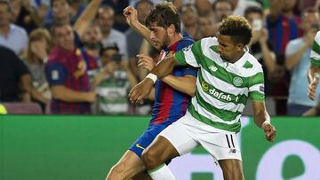 Sergi Roberto pugnando un balón con Sinclair.