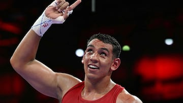 Spain's Ayoub Ghadfa Drissi El Aissaoui celebrates his victory over Armenia's Davit Chaloyan at the end of their men's +92kg quarter-final boxing match during the Paris 2024 Olympic Games at the North Paris Arena, in Villepinte on August 2, 2024. (Photo by MOHD RASFAN / AFP)