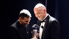 Soccer Football - The Best FIFA Football Awards - Salle Pleyel, Paris, France - February 27, 2023 Paris St Germain's Lionel Messi winner of The Best FIFA Player award 2022 receives the trophy from FIFA president Gianni Infantino REUTERS/Sarah Meyssonnier