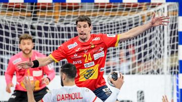 CAIRO, EGYPT - JANUARY 19: Mohamed Darmoul of Tunisia is challenged by Viran Morros de Argila of Spain during the 27th IHF Men's World Champioship Group B match between Spain and Tunisia at New Capital Sports Hall on January 19, 2021 in Cairo, Egypt. (Photo by Slavko Midzor/Pixsell/MB Media/Getty Images)
