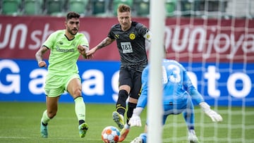 24 July 2021, Switzerland, St. Gallen: Bilbao's Unai Nunez and Dortmund's Marco Reus battle for the ball during the Club friendly soccer match between Borussia Dortmund and Athletic Bilbao at Kybun park. Photo: David Inderlied/dpa - IMPORTANT NO