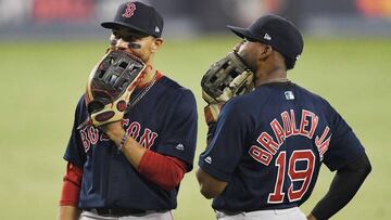 LOS ANGELES, CA - OCTOBER 26: Mookie Betts #50 of the Boston Red Sox and Jackie Bradley Jr. #19 talk during the thirteenth inning against the Los Angeles Dodgers in Game Three of the 2018 World Series at Dodger Stadium on October 26, 2018 in Los Angeles, California.   Kevork Djansezian/Getty Images/AFP
 == FOR NEWSPAPERS, INTERNET, TELCOS &amp; TELEVISION USE ONLY ==