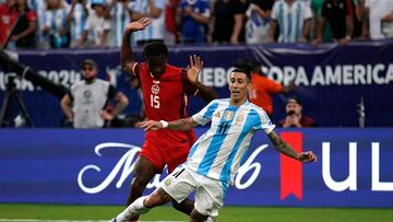 Argentina's forward #11 Angel Di Maria fights for the ball with Canada's defender #15 Moise Lumpungu during the Conmebol 2024 Copa America tournament semi-final football match between Argentina and Canada at MetLife Stadium, in East Rutherford, New Jersey on July 9, 2024. (Photo by EDUARDO MUNOZ / AFP)