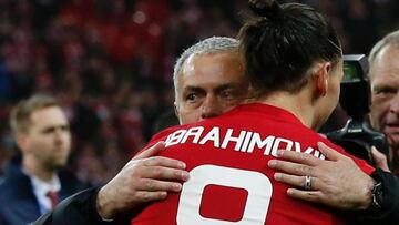 Manchester United's Swedish striker Zlatan Ibrahimovic embraces Manchester United's Portuguese manager Jose Mourinho