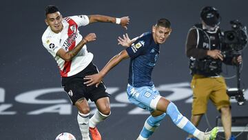 BUENOS AIRES, ARGENTINA - MARCH 28:  Matias Suarez of River Plate fights for the ball with Juan Jose Caceres of Racing Club during a match as part of Copa de la Liga Profesional 2021 between River Plate and Racing Club at Estadio Monumental Antonio Vespucio Liberti on March 28, 2021 in Buenos Aires, Argentina. (Photo by Marcelo Endelli/Getty Images)