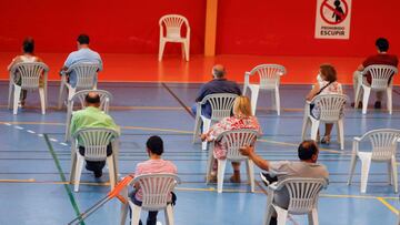 People wait after receiving their vaccine against the coronavirus disease (COVID-19) at a vaccination centre in Ronda, Spain June 9, 2021. REUTERS/Jon Nazca
