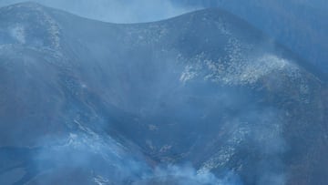 The main cone of the Cumbre Vieja volcano without activity in the last few hours is seen from the Tajuya viewpoint, on the Canary Island of La Palma, Spain, December 15, 2021. 