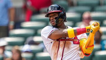 Jul 2, 2023; Cumberland, Georgia, USA; Atlanta Braves right fielder Ronald Acuna Jr. (13) hits a double against the Miami Marlins during the seventh inning at Truist Park. Mandatory Credit: Dale Zanine-USA TODAY Sports