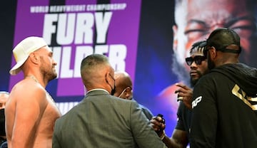 Tyson Fury (L) and Deontay Wilder face-off on June 15, 2021 in Los Angeles, California at a press conference to announce their third WBC heavyweight championship fight scheduled for July 24 in Las Vegas.