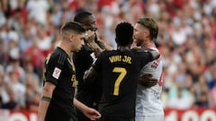 Sevilla's Spanish defender #04 Sergio Ramos (R) and Real Madrid's German defender #22 Antonio Rudiger (2nd-L) argue during the Spanish league football match between Sevilla FC and Real Madrid CF at the Ramon Sanchez Pizjuan stadium in Seville on October 21, 2023. (Photo by CRISTINA QUICLER / AFP)