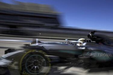 Hamilton, oblivious to late night tinkering as he takes pole