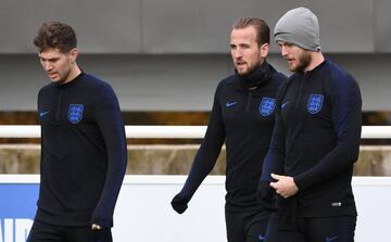 England's defender John Stones (L), England's striker Harry Kane (C) and England's midfielder Eric Dier arrive for a England team training session at St George's Park in Burton-on-Trent, central England on November 14