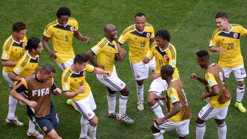 Colombia's players dance after scoring a goal during the Group C football match between Colombia and Ivory Coast at the Mane Garrincha National Stadium in Brasilia during the 2014 FIFA World Cup on June 19, 2014. AFP PHOTO / EVARISTO SA (Photo credit should read EVARISTO SA/AFP/Getty Images)