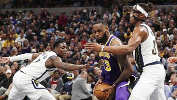 Feb 5, 2019; Indianapolis, IN, USA; Los Angeles Lakers forward LeBron James (23) is guarded by Indiana Pacers center Myles Turner (33) and guard Darren Collison (2) during the third quarter at Bankers Life Fieldhouse. Mandatory Credit: Brian Spurlock-USA TODAY Sports